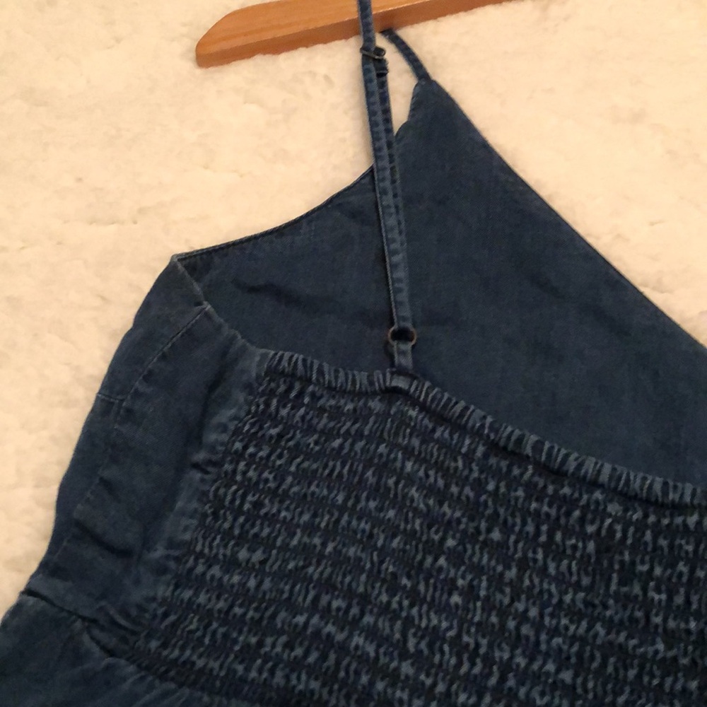Lightweight, tiered, fit-and-flare style navy top w/adjustable spaghetti straps